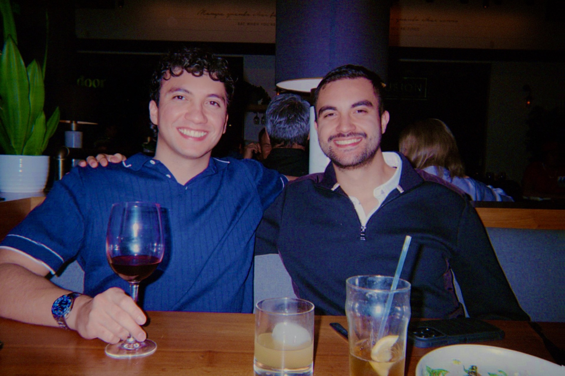 Matthew and his brother Thomas seated together at dinner.